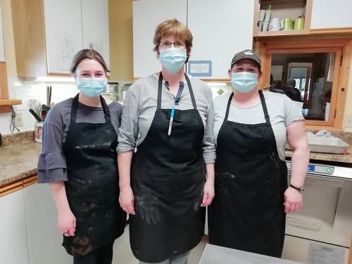 Left to right: Natalie Reynolds, Anne Howes and Laura Wood prepare Meals-On-Wheels for Rural Frontenac Community Services.